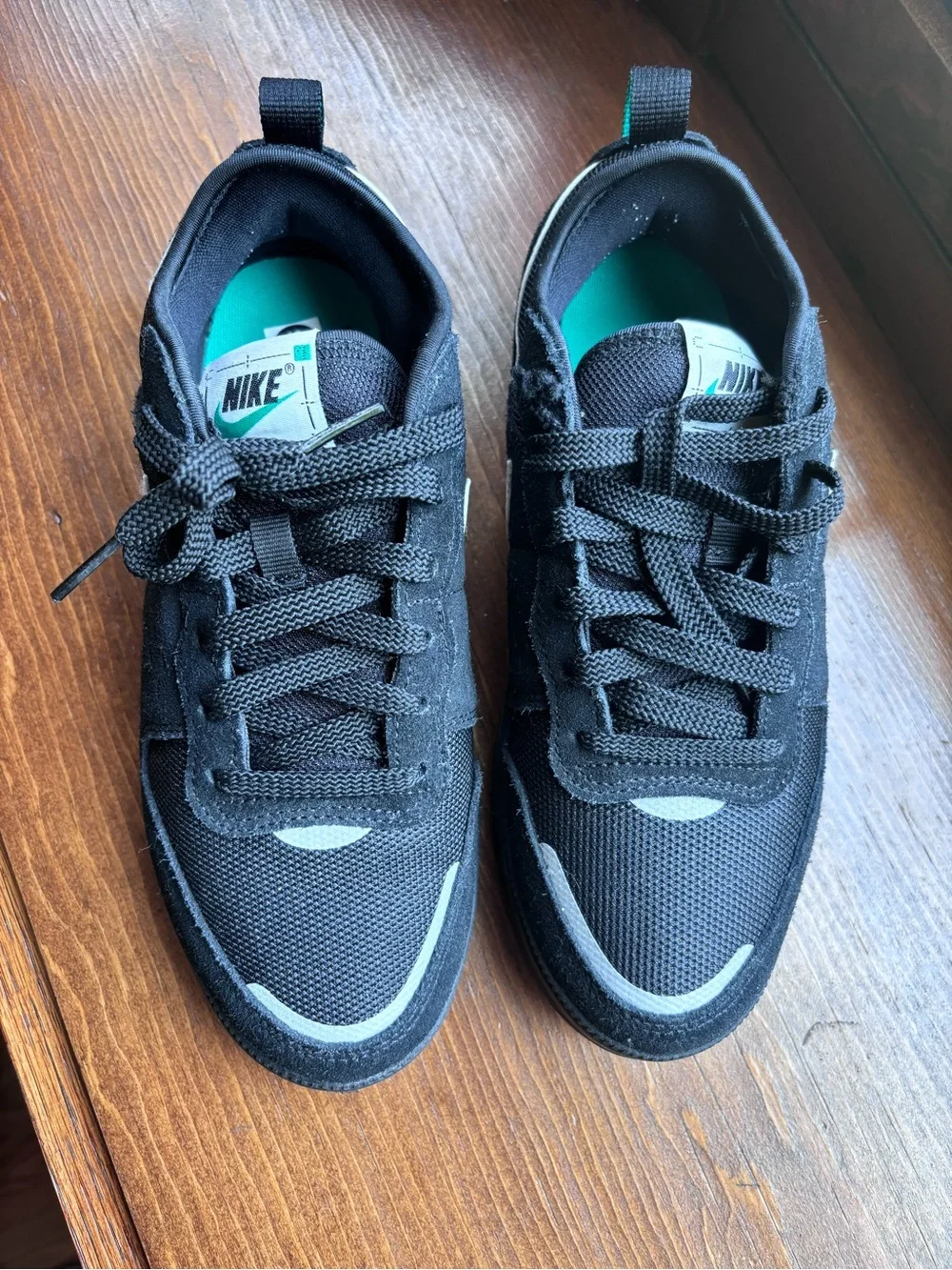 Nike Black Sneakers with Teal Accents